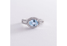 Серебряное помолвочное кольцо с голубым 
топазом и фианитами
