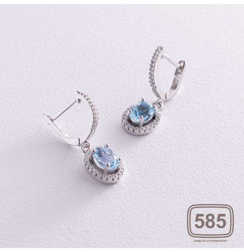 Срібні сережки з блакитними топазами і 
фіанітами