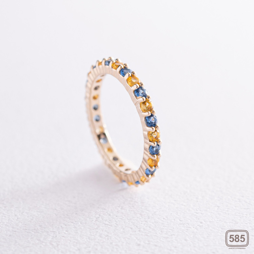 Кольцо с дорожкой голубых и желтых камней 
(желтое золото)
