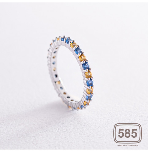Кольцо с дорожкой голубых и желтых камней 
(белое золото)