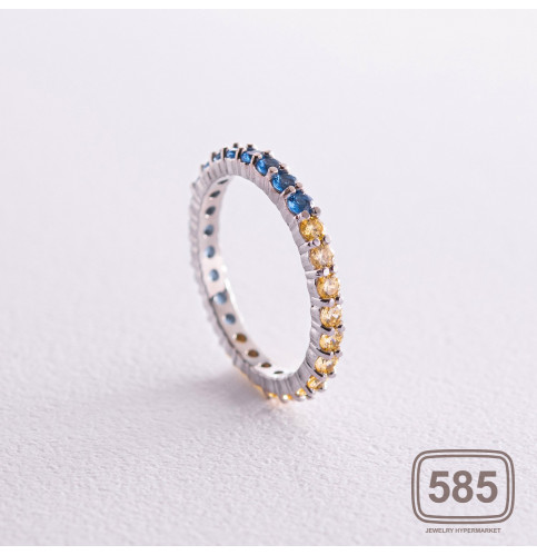 Серебряное кольцо с дорожкой голубых и 
желтых камней